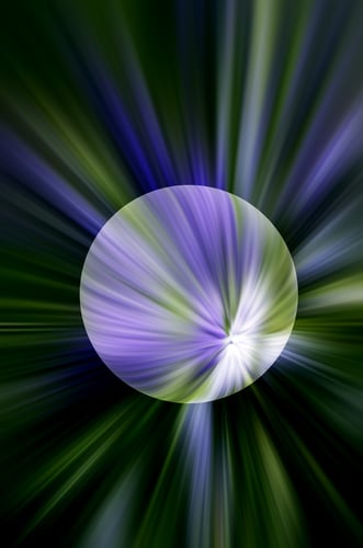 Abstract blue and green planet with ice cap against a varicolored background of streaks with radial blur like a nearby starburst, for environmental or astronomical themes Abstract blue and green planet with ice cap against a varicolored background of streaks with radial blur like a nearby starburst, for environmental or astronomical themes